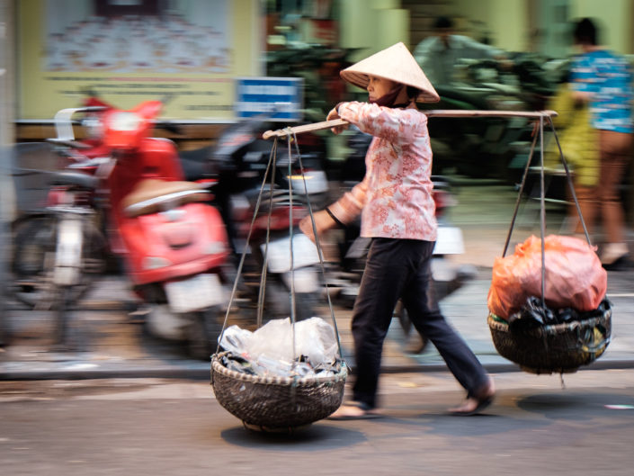 Vietnamese woman carrying baskets