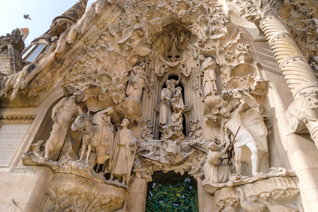 Intricate sculpture work on the Nativity facade depicting the birth of Christ.