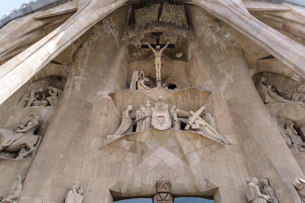 Stark and angular design of the Passion facade, depicting the crucifixion of Christ.